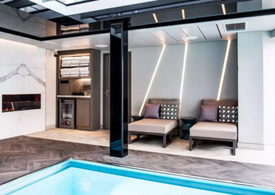 Lounge chairs by swimming pool